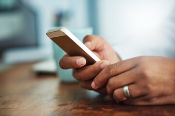 Poster - always connected, always available. closeup shot of a businessman texting on a cellphone at work.