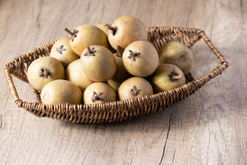 Wall Mural - Fresh sapodilla in basket tropical fruit evergreen tree and sweet taste fruit