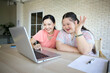 © offsuperphoto - young teenage girl and her teacher studying how to use laptop computer and talking online to someone
