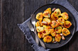 roasted squashed potatoes with garlic and sage