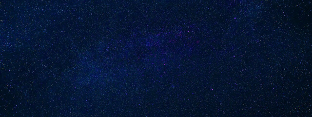 Wall Mural - Stars on background of the night starry sky. Milky Way, galaxies and universes on a dark blue background