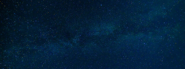 Wall Mural - tellar Milky Way at night with stars. Panorama of the dark blue starry sky