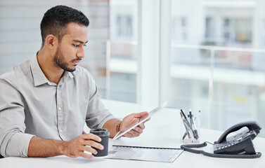 Poster - Taking my work with me on the go. Shot of a young businessman using a digital tablet at work.