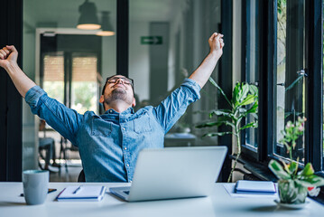 hardworking caucasian man, stretching after a busy day.