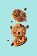 oatmeal chocolate chip cookies swirl on blue background