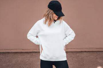 Wall Mural - White hoodie on a young woman, mockup.