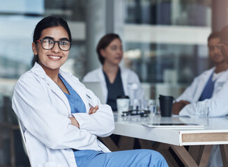 Aufkleber - Its always great to catch up with coworkers. Shot of a female doctor sitting down to take a break from her work.