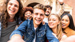 © Davide Angelini - Happy tourists group taking selfie photo walking in european city street - Multiracial young people smiling together at camera outside - University students enjoying day out in college campus