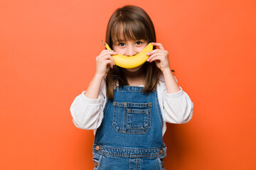 Girl having fun with some fruit