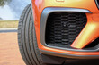 Close up of an orange car air intake