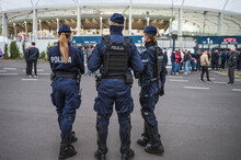 Policemen In Front Of The Stadium Before Football Match.