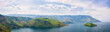 © fabio lamanna - Lake Toba and Samosir Island view from above Sumatra Indonesia. Huge volcanic caldera covered by water, traditional Batak villages, green rice paddies, equatorial forest.
