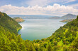 © fabio lamanna - Lake Toba and Samosir Island view from above Sumatra Indonesia. Huge volcanic caldera covered by water, traditional Batak villages, green rice paddies, equatorial forest.