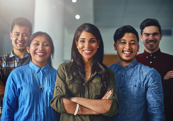 Wall Mural - We boast a track record of multiple successes. Portrait of a team of confident young designers standing together in an office.