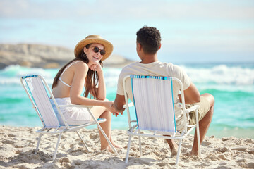 Poster - Anywhere with you is a magical time. Shot of a young couple relaxing at the beach.