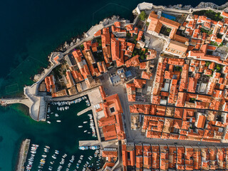 Wall Mural - Old town of Dubrovnik on Adriatic sea coast in Dalmatia region, Croatia. Aerial top down view from drone