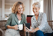 © N Felix/peopleimages.com - Your grandson has grown so much. Shot of two female friends drinking coffee while using a digital tablet.