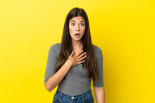 Young Brazilian Woman Isolated On Yellow Background Surprised And Shocked While Looking Right