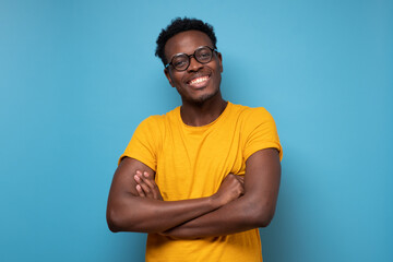 Wall Mural - Smiling african man looking at camera. Portrait of black confident man