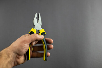 tool pliers on a black background