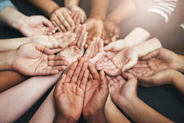 Poster - Together we stand. Closeup shot of a group of unidentifiable people holding out their cupped hands.