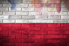 Flaga Polski Namalowana Na Ceglanym Murze. The Polish Flag Painted On A Brick Wall.