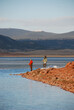 A pair of anglers try their luck on a mountain reservoir 