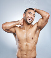 In Order To Look Good, You Have To Practice Good Hygiene. Studio Shot Of A Handsome Young Man Taking A Shower Against A Grey Background.