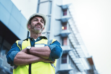 youll always get a solid foundation with him. shot of a engineer standing in front of a building.