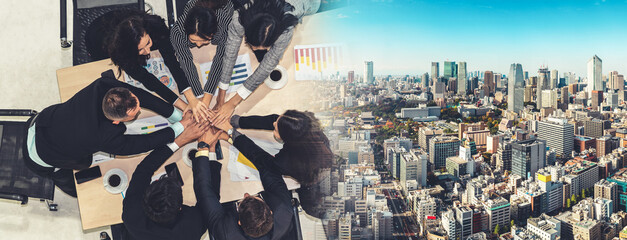 Wall Mural - Happy business people celebrate teamwork success together with joy at office table shot from top view . Young businessman and businesswoman workers express cheerful victory in broaden view .