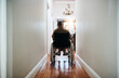 Let the promise of tomorrow keep you going. Rearview shot of a senior woman sitting in her wheelchair at home.