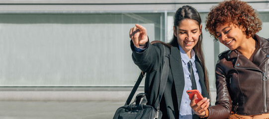 girl showing the address showing the mobile phone