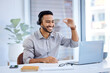 © StJohn Lombard/peopleimages.com - The definition of a top level salesman. Shot of a young businessman wearing a headset while working on a laptop in an office.