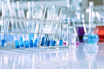 Wall Mural - glass flask in chemical science education laboratory with molecular structure in blue background