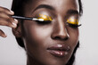 © Marius V/peopleimages.com - Try something different and color outside the lines. Studio shot of a beautiful young woman applying eye makeup.