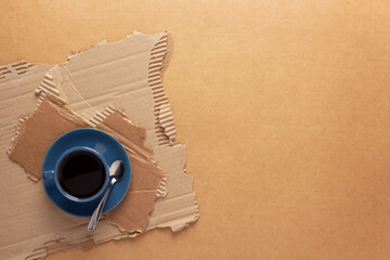 Canvas Print - Cup of coffee in torn paper. Coffee espresso on cardboard background