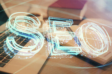 Aufkleber - Double exposure of SEO writing and desktop with coffee and items on table background. Concept of search optimization.