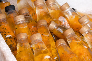 Passion fruit bottles fresh juice close-up. lifestyle photos from the streets of Thailand.