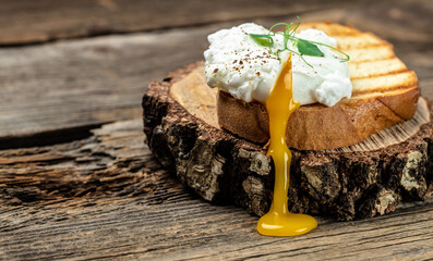 Wall Mural - Poached egg on toast for breakfast or lunch with rye bread. vegetarian food, diet concept
