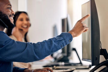 Poster - I found a quick way to solve this. Shot of a young call centre agent working on a computer with a colleague in an office.