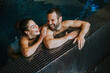 © BGStock72 - Young couple relaxing in a swimming pool