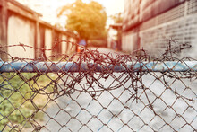 Barbed Wire Entrance Fences Prevent Intruders From Entering Restricted Areas.