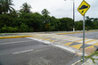 Speed bump on asphalt road, speed bump on street. Brazilian name quebra mola or lombada. State of Maranhão, Brazil.