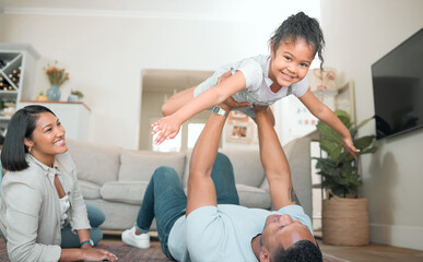 Poster - Higher Dad, higher. Shot of an adorable little girl bonding with her parents in the living room at home.