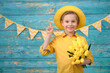 © Jacek - A young boy and decorations for Easter. Studio background.
