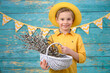 © Jacek - A young boy and decorations for Easter. Studio background.