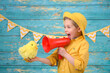 © Jacek - A young boy and decorations for Easter. Studio background.