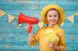 © Jacek - A young boy and decorations for Easter. Studio background.