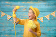 © Jacek - A young boy and decorations for Easter. Studio background.