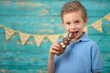© Jacek - A young boy and decorations for Easter. Studio background.
